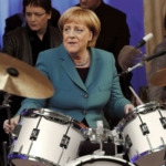 Fanta2905_Angela_Merkel_playing_drums_2fa5a6e4-9288-40c6-99f3-d52bfad50a5b